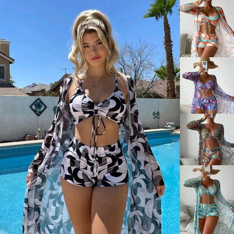 Women's 3-piece spring bikini set with long sleeve cardigan featuring floral pattern, ideal swimwear for summer beach outings.