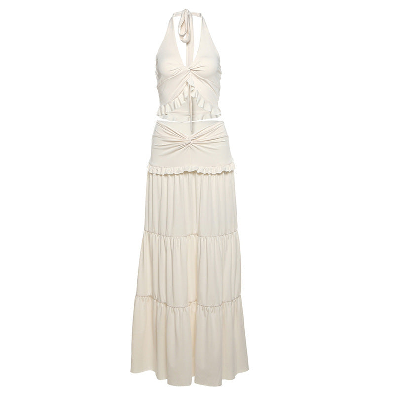 Women's milky white V-neck halter vest with high waist mid-length skirt set.
