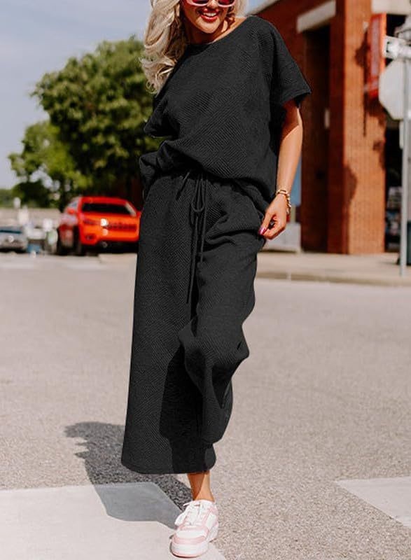 Solid color casual fashion women's two-piece set with short sleeves and trousers, street style.