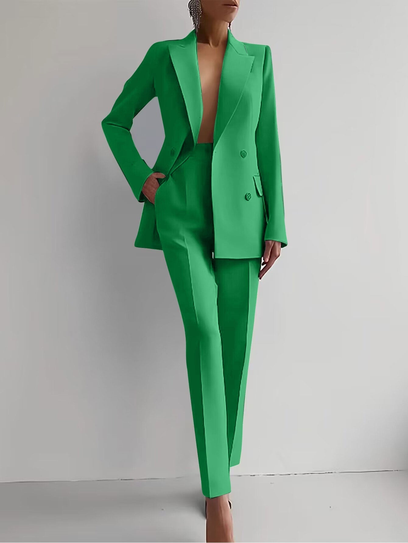 Women's casual green suit with long sleeve single-breasted jacket and slim fit trousers.