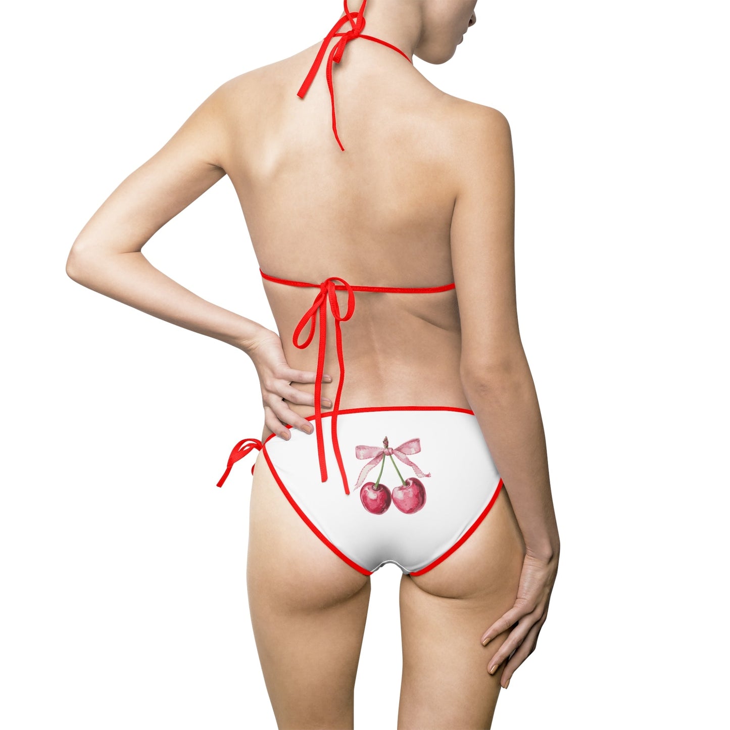 Cherry patterned bikini swimsuit with red straps, showcasing a fun and playful design perfect for beachwear.