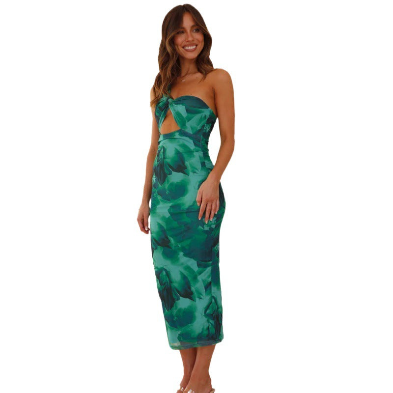 European and American ladies green sleeveless hollow dress with floral pattern.