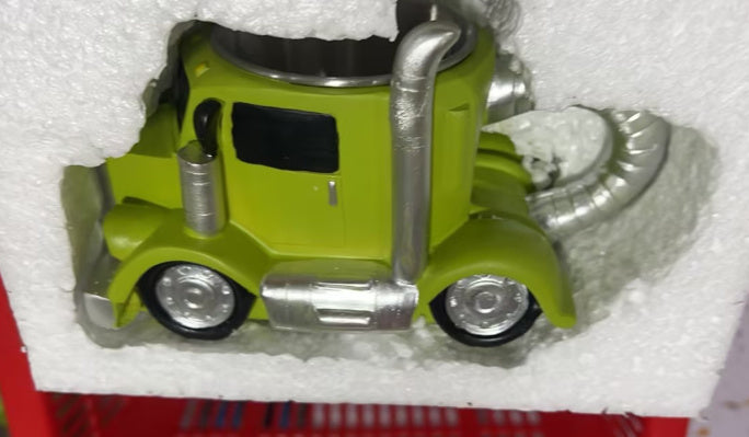Handcrafted ceramic coffee mug in a green semi-truck shape, featuring a unique and durable design perfect for truck lovers.