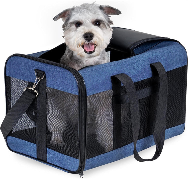 Breathable pet carrier bag for dogs and cats, made with durable blue oxford cloth, ideal for travel.