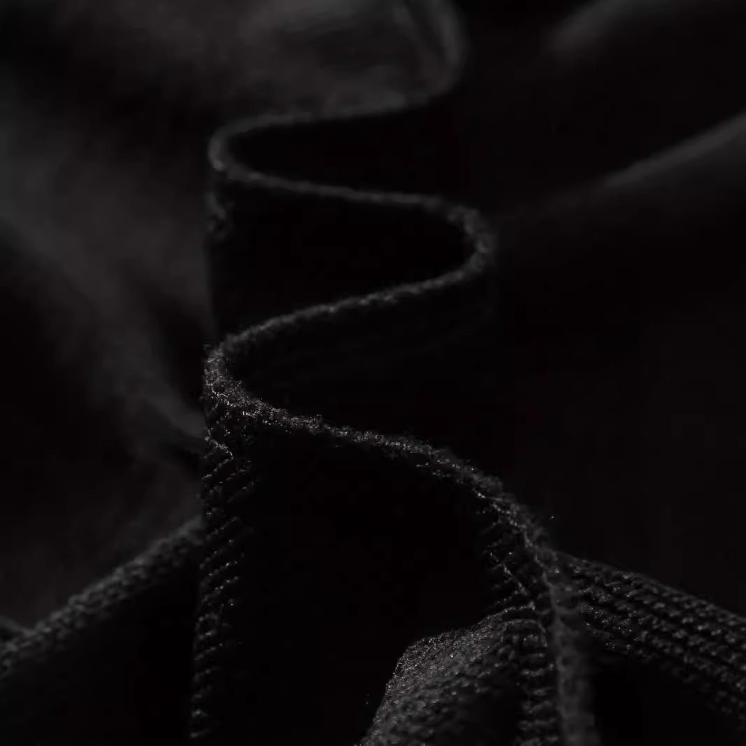 Close-up of polyester fabric used in women's printed long sleeve crew neck sweater.