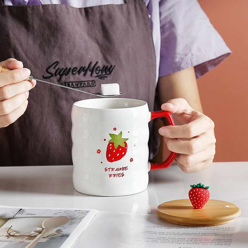Large capacity ceramic mug with bamboo lid featuring a strawberry design, cylindrical shape, and red handle.