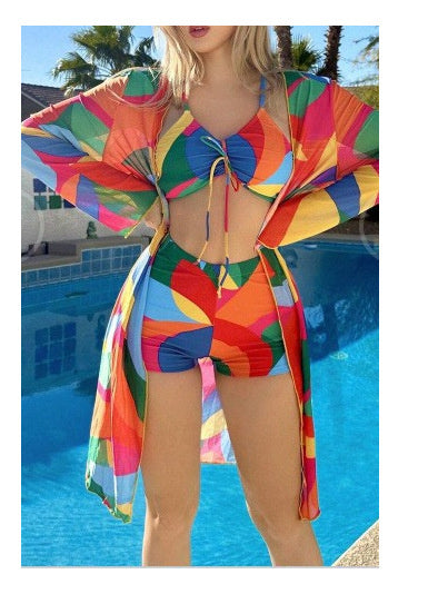 Colorful floral bikini set with long sleeve cardigan, perfect swimwear for women.