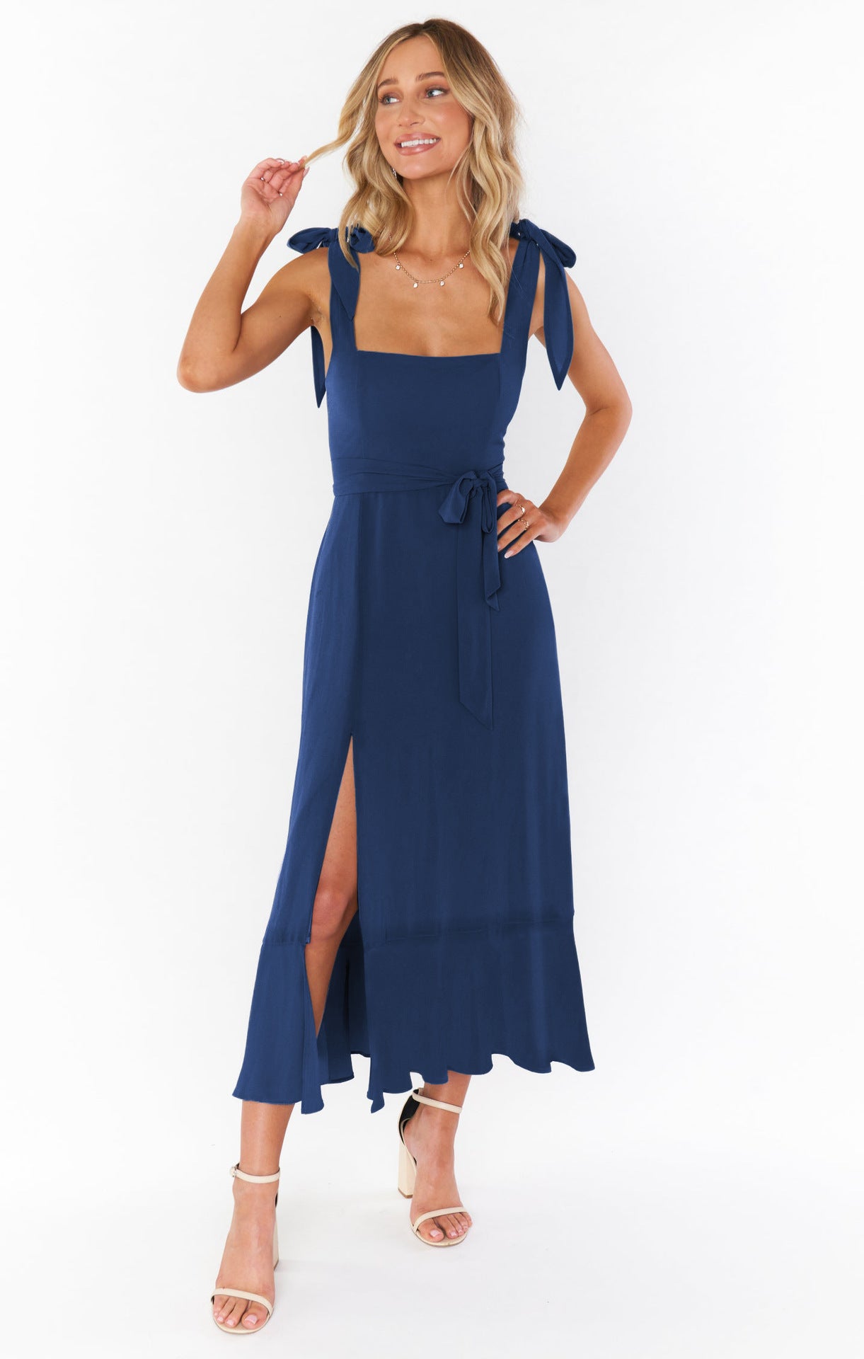 Summer blue lace-up dress with ruffled hem and split design.