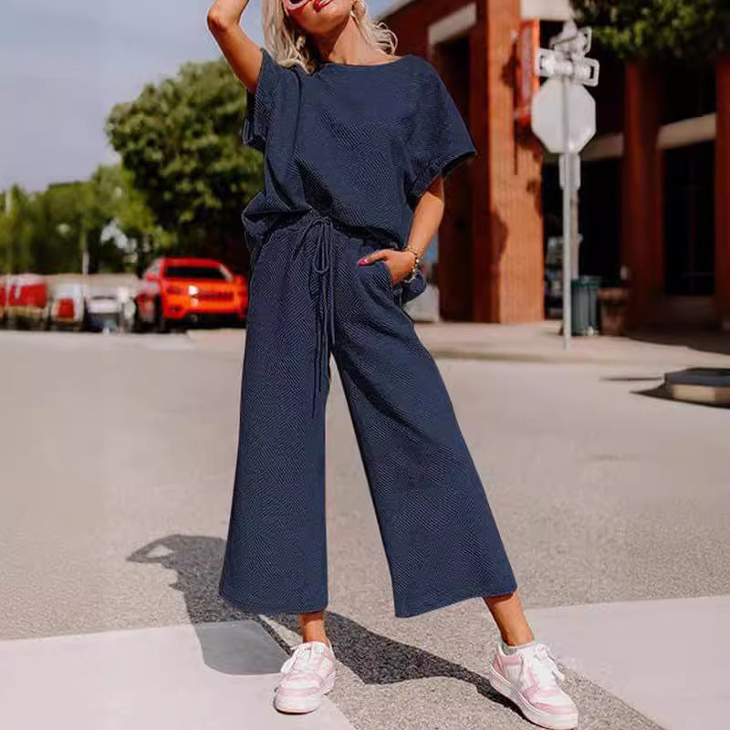 Solid color short-sleeved trousers two-piece set for women in dark blue.