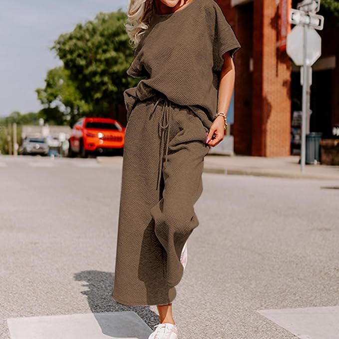 Casual fashion women's solid color two-piece set with short-sleeved top and trousers in brown, polyester fabric.
