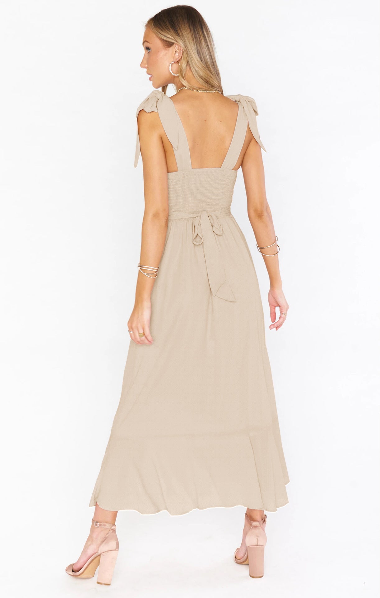Fashionable women's lace-up suspender dress with ruffled hem, perfect for summer beach outings.