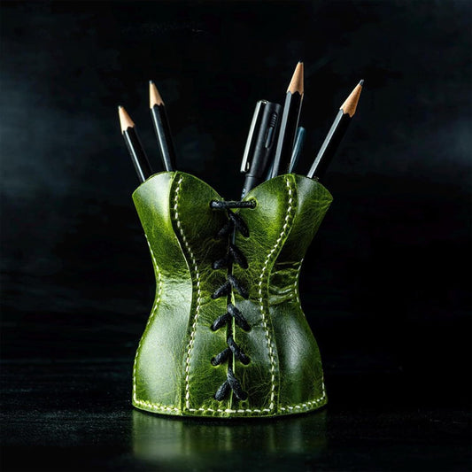 Green leather corset pen holder in novelty design.