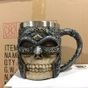 3D skull design ceramic coffee mug with handle, 400ml capacity.