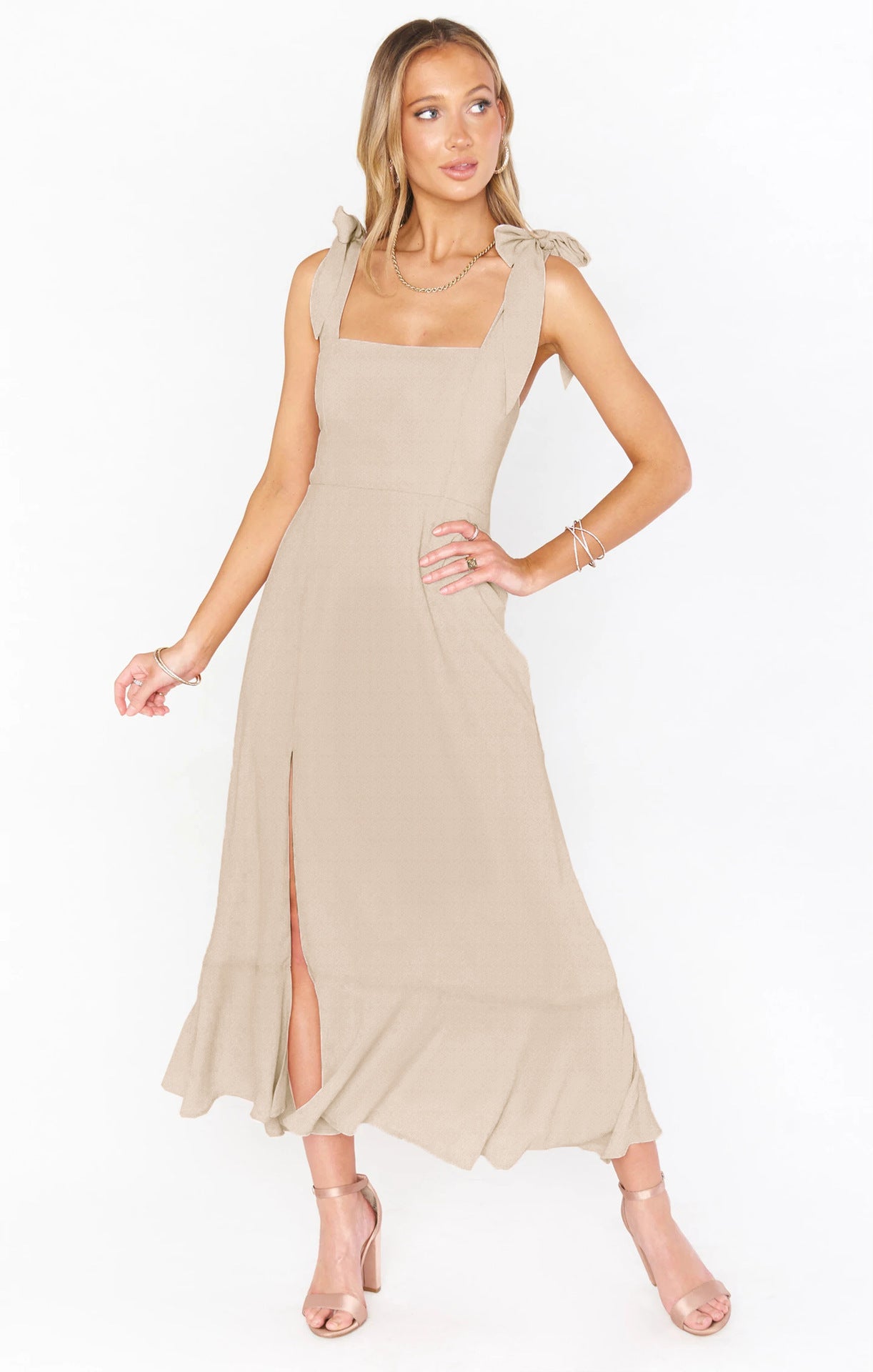 Women’s beige lace-up suspender split dress with ruffle hem.