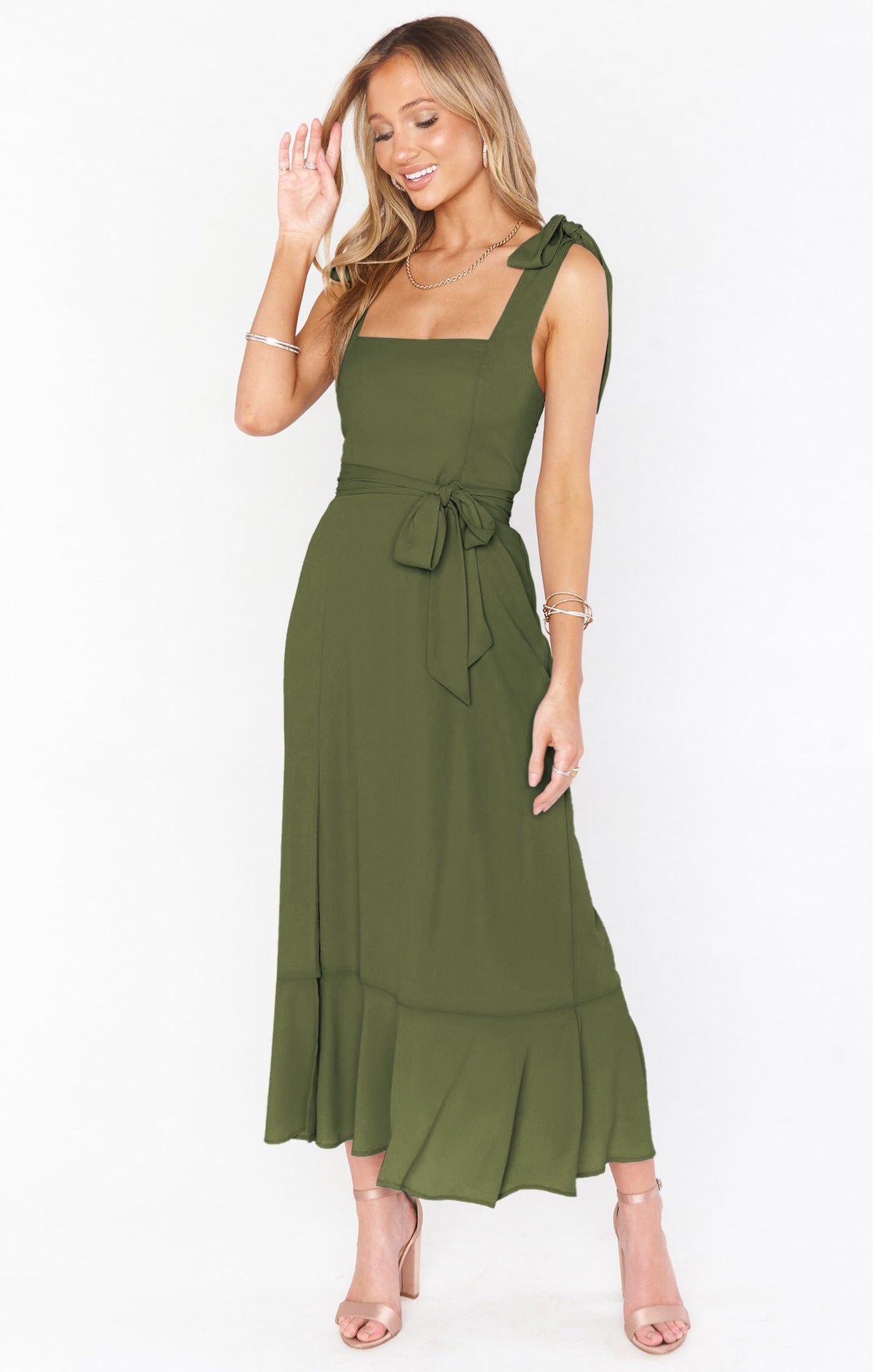 Women's green lace-up suspender dress with ruffled hem, ideal for summer beach fashion.