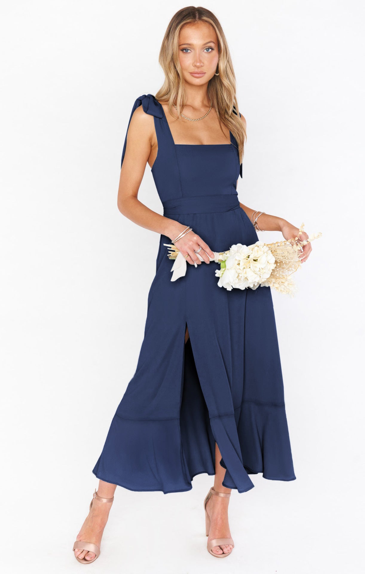 Stylish navy blue lace-up suspender dress with ruffled hem, perfect for summer beach outings.