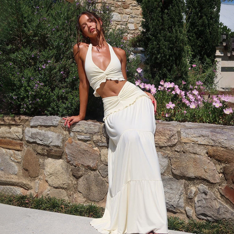 Women's V-neck halter vest high waist skirt set in milky white, mid-length, sleeveless.
