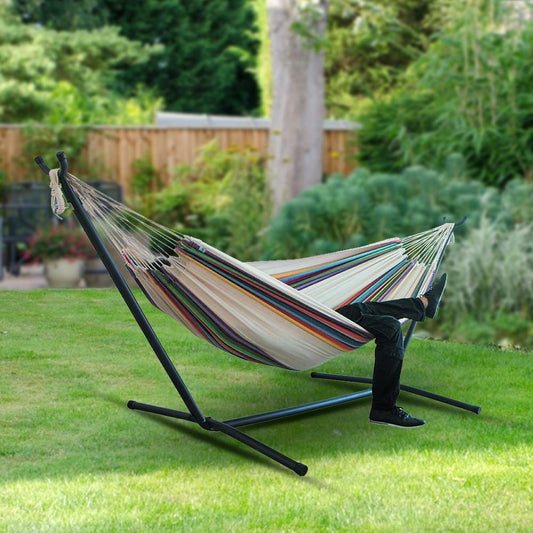 Canvas camping hammock in garden setup without stand.