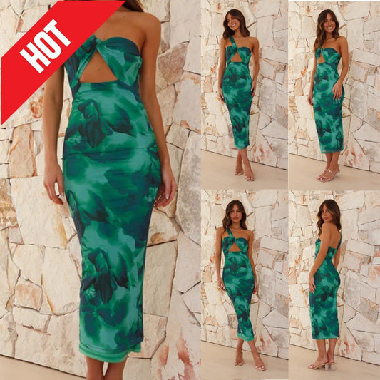 Green floral sleeveless hollow dress with mid-length skirt and zipper detail.