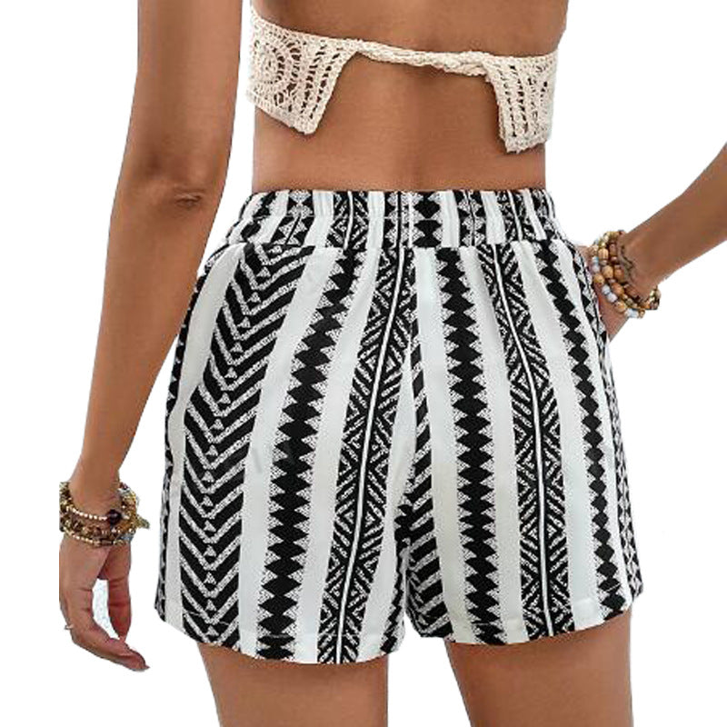 Women's fashionable lace-up shorts in black and white with elegant design, polyester fabric, and stripe pattern.