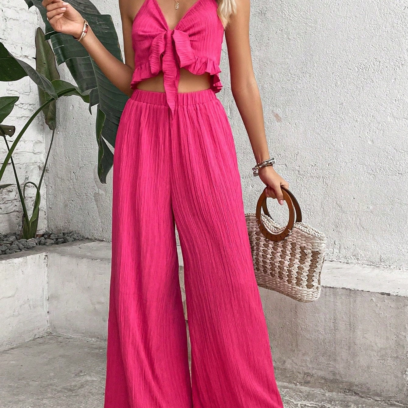 Elegant pink knot front cami top and wide leg pants set for spring/summer.