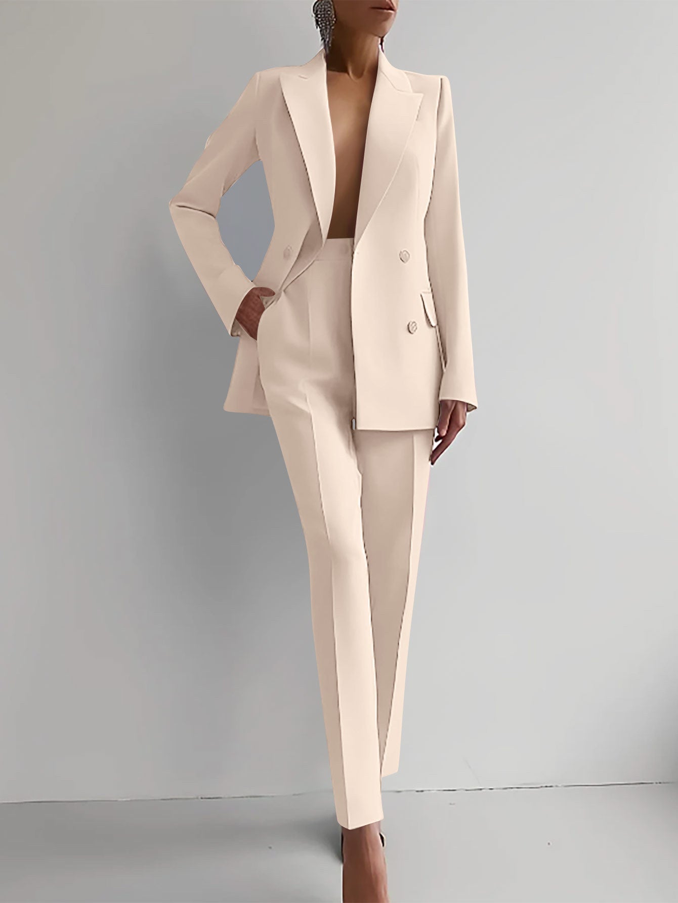 Women's casual suit with long sleeve single-breasted jacket and slim fit trousers in apricot color.