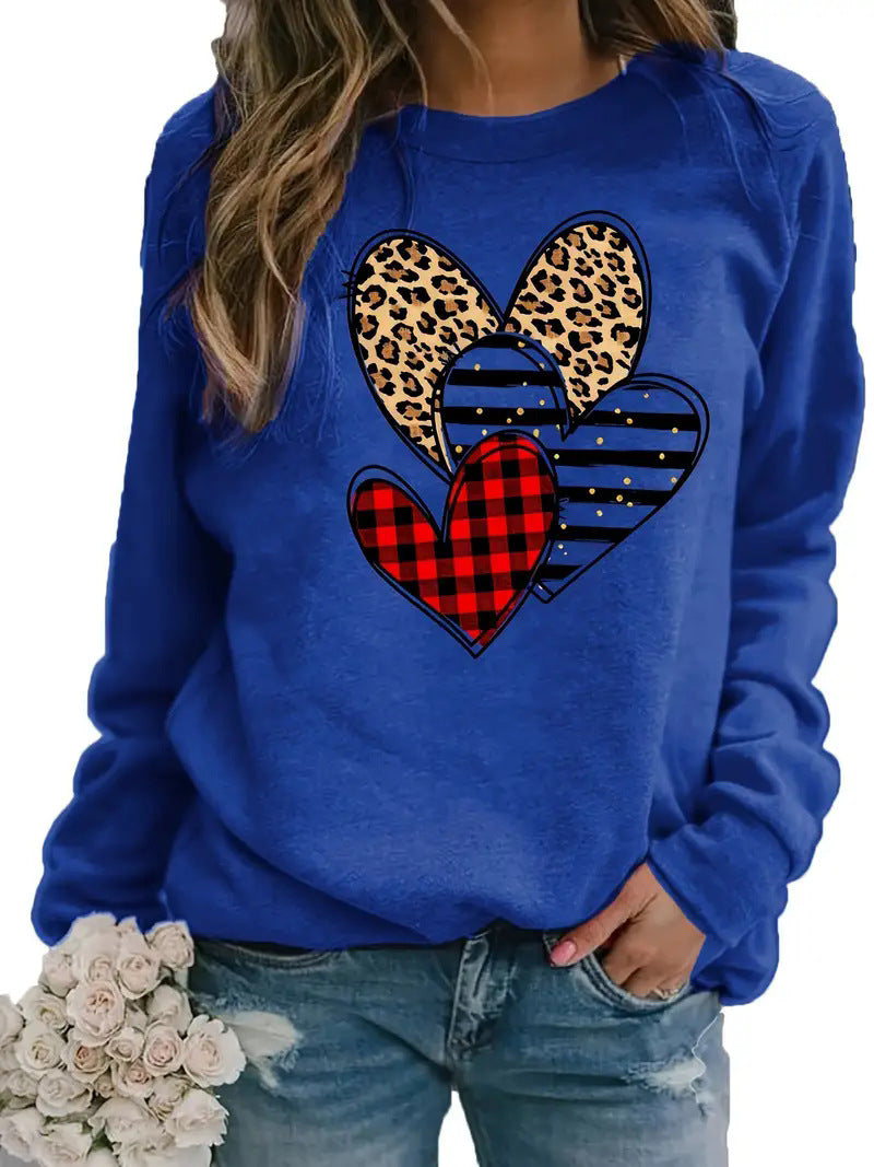 Women's printed long sleeve crew neck sweater with heart design.