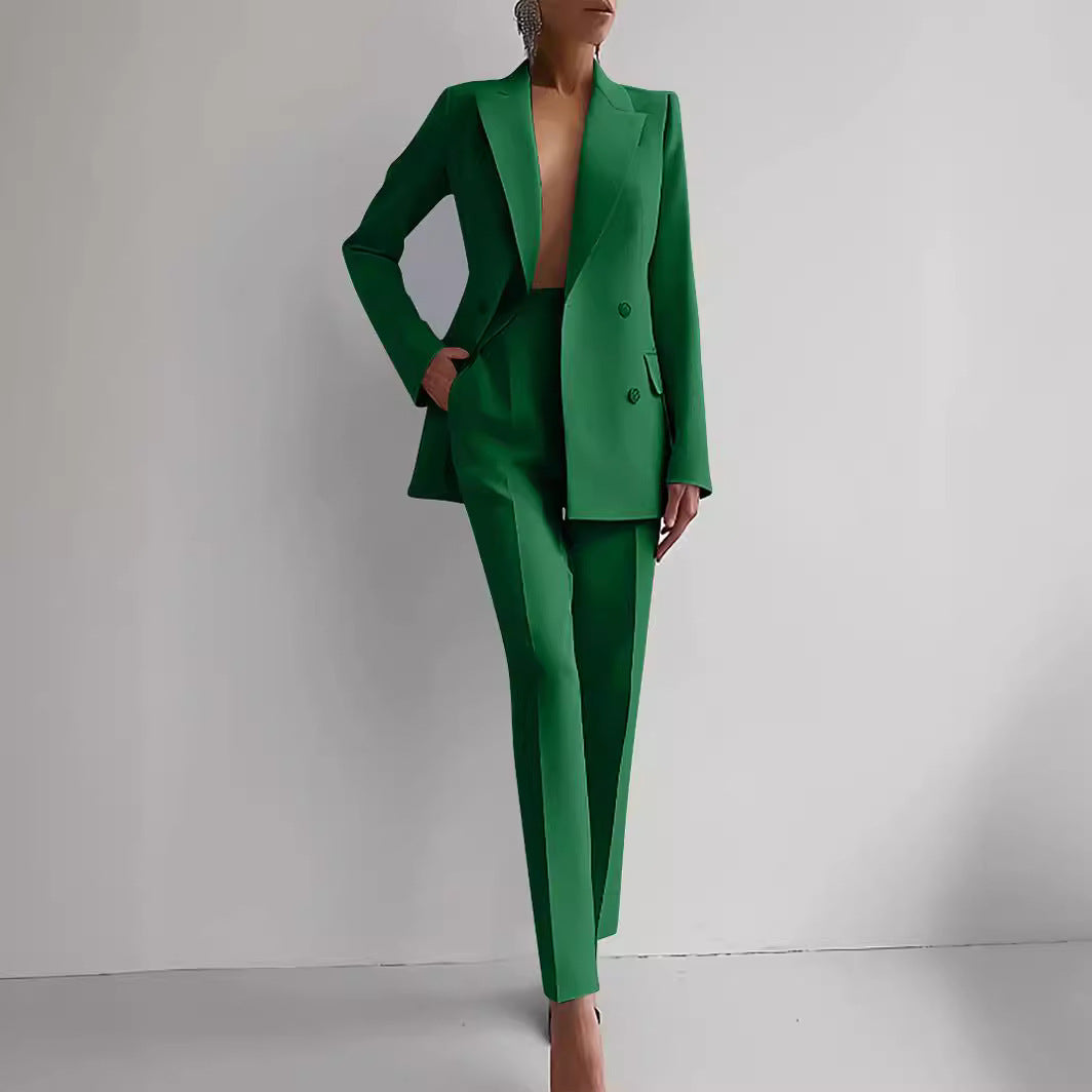 Women's green casual business suit with long sleeve single-breasted jacket and slim fit trousers.