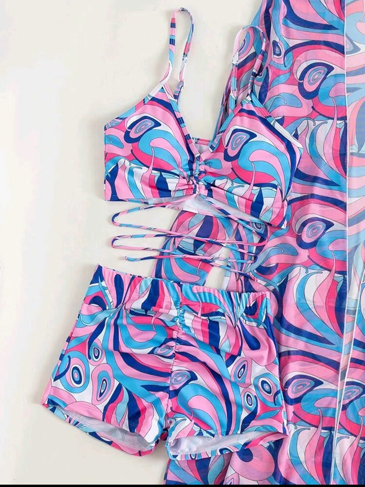 Women's floral swimsuit set with long-sleeve cardigan, featuring colorful spring design, perfect for summer beachwear.