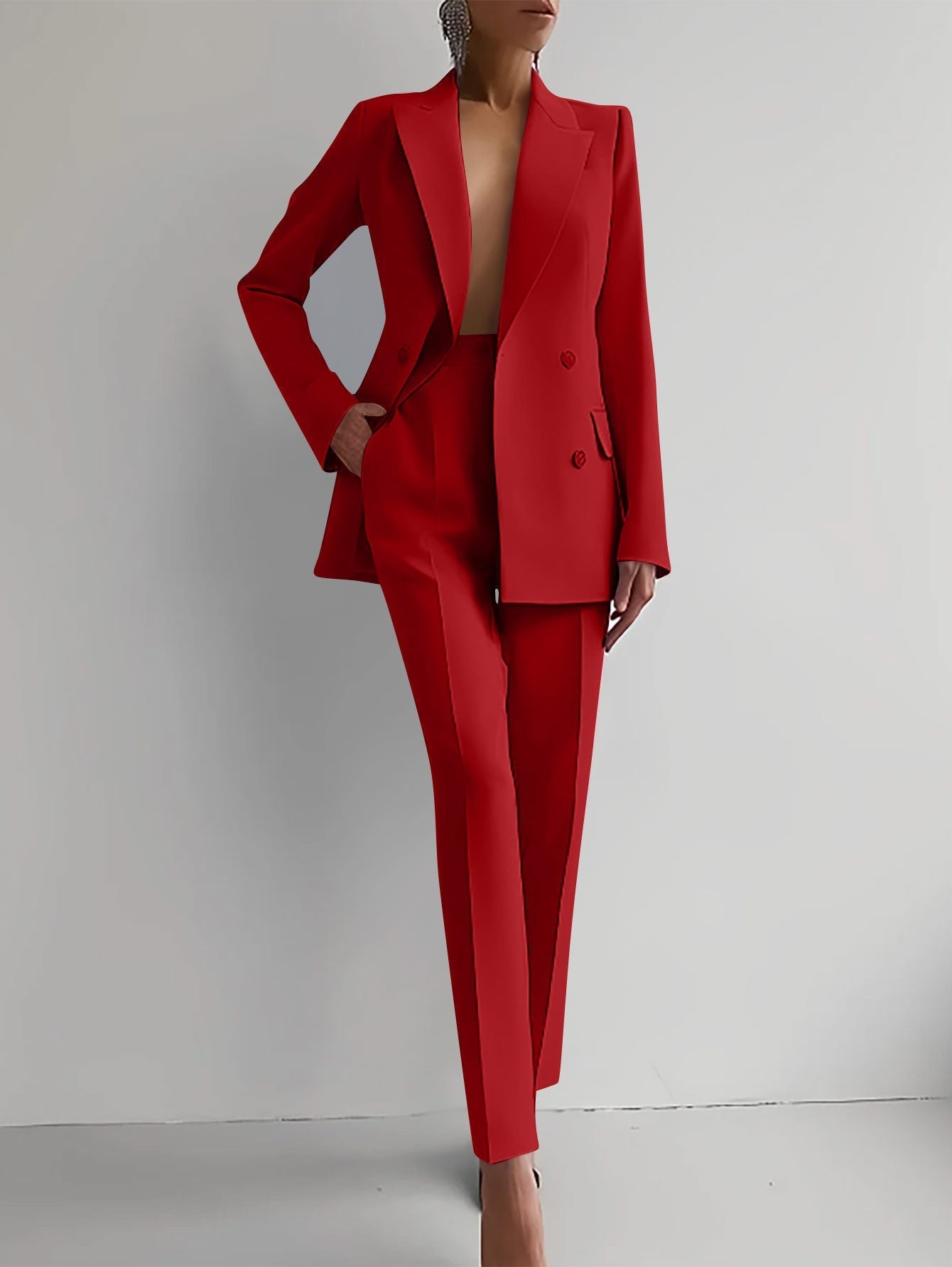 Women's red casual business suit with long-sleeve jacket and slim fit trousers.