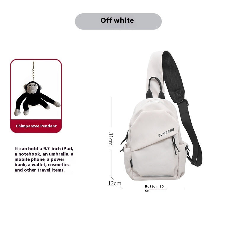 Off-white men's crossbody bag with chimpanzee pendant, ideal for travel; fits iPad, notebook, and essentials.