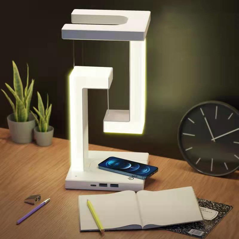 Wireless charging suspension table lamp with magnetic floating design for home or office.